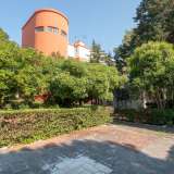 Poi c�� il fabbricato che accoglie il circolo Sottufficiali e al livello superiore gli alloggi, caratterizzato da una sorta di torre che svetta tra gli alberi circostanti